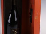the bottle of champagne is in the box and ready to be opened
