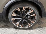 a close up view of a car ' s wheel on the ground