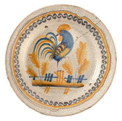 a plate with a rooster painted on it