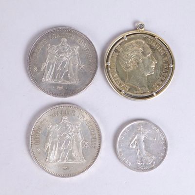 four different coins are shown on a white surface with a white background