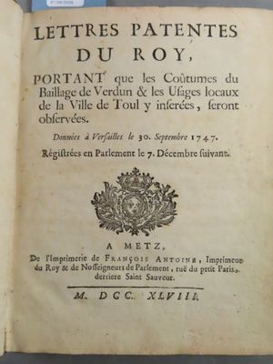 a book with a picture of a coat of arms on it