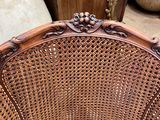a wicker chair that is sitting on the floor