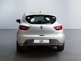 the rear end of a silver car in a white room