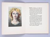 an open book with a picture of a woman ' s face on it