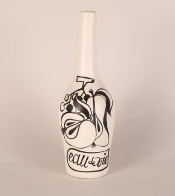 a white vase with a black design on it
