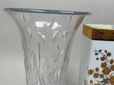 two vases sitting next to each other on a table