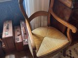 a chair that is sitting in front of a window