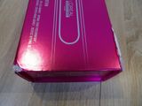 a pink box that is on a wooden table