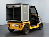 a small yellow truck with an open door on the back of it