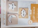 a cardboard box with a pair of fake eyelashes in it
