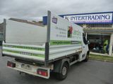 a white truck that is parked in front of a building