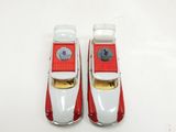 pair of red and white toy cars sitting on top of a white surface