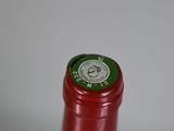 a close up of a bottle of wine on a table