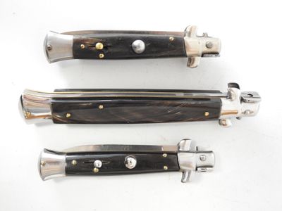 three different types of knives are shown on a white surface