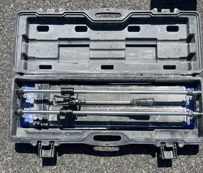 a tool kit in a plastic case on the ground