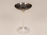 an image of a white table with a silver plate on it