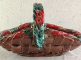 a close up of a basket on a table with a white background