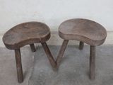 two small wooden stools sitting next to each other