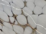 a close up view of a bowl of white rocks