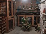 many bottles of wine sitting on shelves in a wine cellar