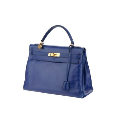 a blue leather handbag on a white background
