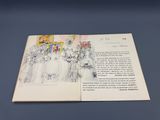 un livre ouvert sur lequel figure le dessin d'un groupe de personnes