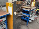 a machine that is working on a piece of metal