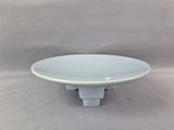 a white bowl that is sitting on a table