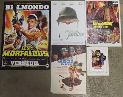 several movie posters are on the floor next to each other