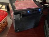 a box of food sitting on a desk next to a computer