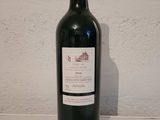 a bottle of wine on a table with a number on it