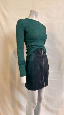 green sweater and black skirt on mannequin mannequin mannequin mannequin mannequin mannequin mannequin mannequin manne