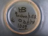 a close up of a metal object with writing on it