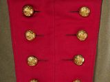 an image of a military uniform with gold buttons on it