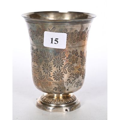 a silver vase that has a price tag on it