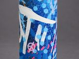 a blue spray can with graffiti on it on a gray surface