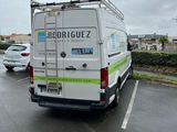 a white van that is parked in a parking lot