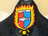 a close up of a fire hydrant with a fish on it