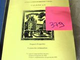 a yellow book with a pink sticker on it