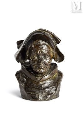 un buste en bronze représentant un homme coiffé d'un chapeau