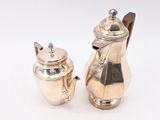 silver plated coffee pot and sugar shaker on a white background
