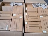 many cardboard boxes that are stacked on top of each other