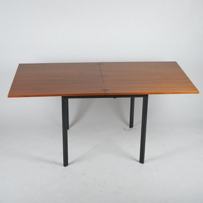 the table is made of wood and black metal legs