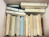 a lot of books in a box on the floor