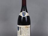 a bottle of red wine with a label on it