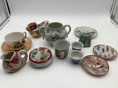 many different types of tea cups and saucers on the table