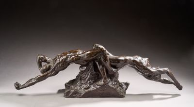 bronze sculpture of a woman and a dog on a rock
