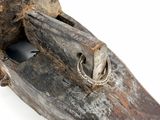 an old wooden object with a bird head on it