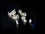 several different types of diamonds on a black surface