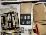 a pile of mail and stamps on top of each other